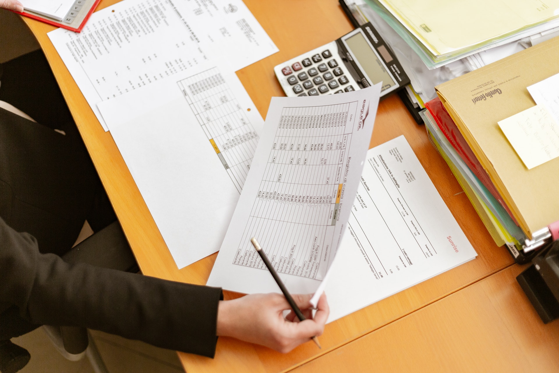 Accountant reviewing expenses for real estate brokerage company