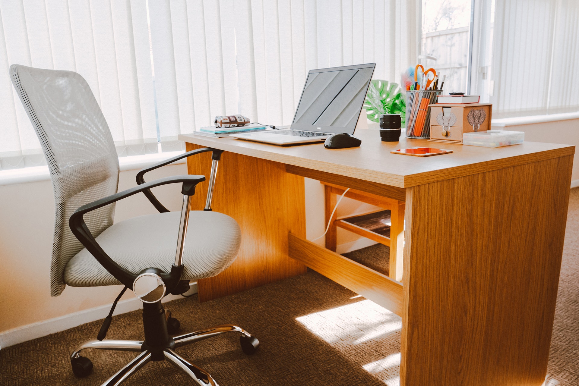 Brown office desk inside a small real estate brokerage office