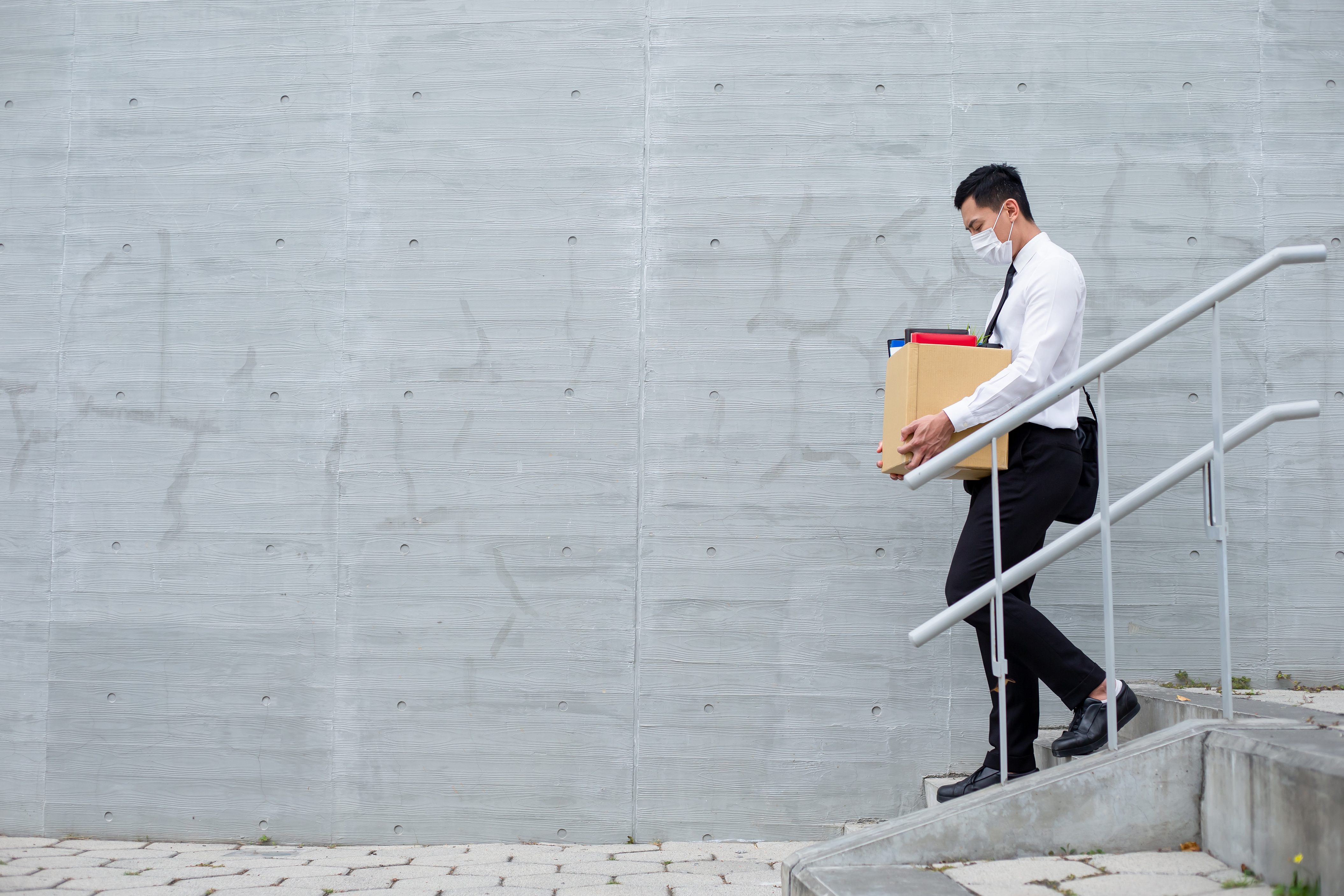 business man packing box after being laid off