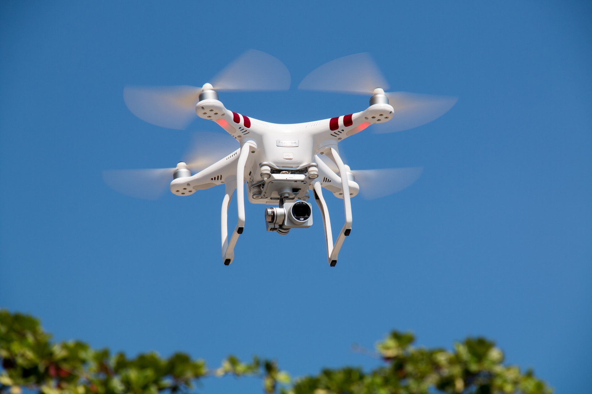 Drone flying taking pictures and video recording real estate property