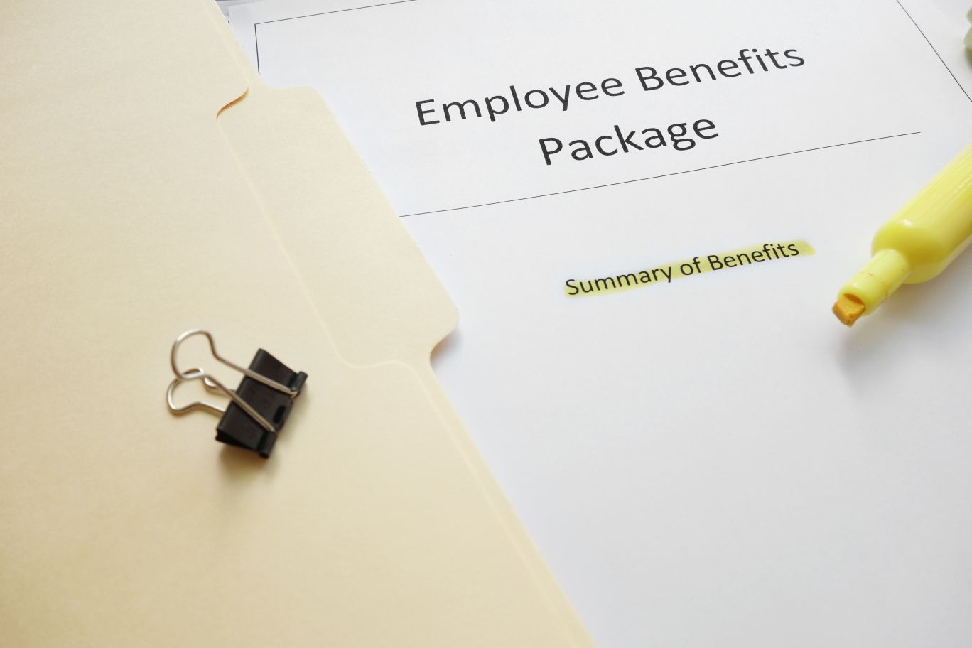 Employee bene paperwork in folder