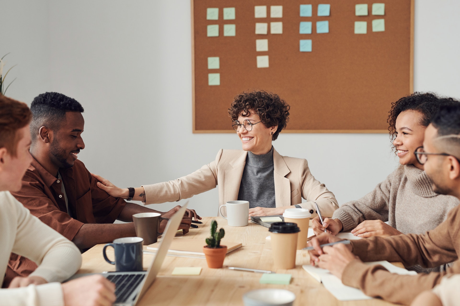 Female real estate agent smiling while conducting meeting