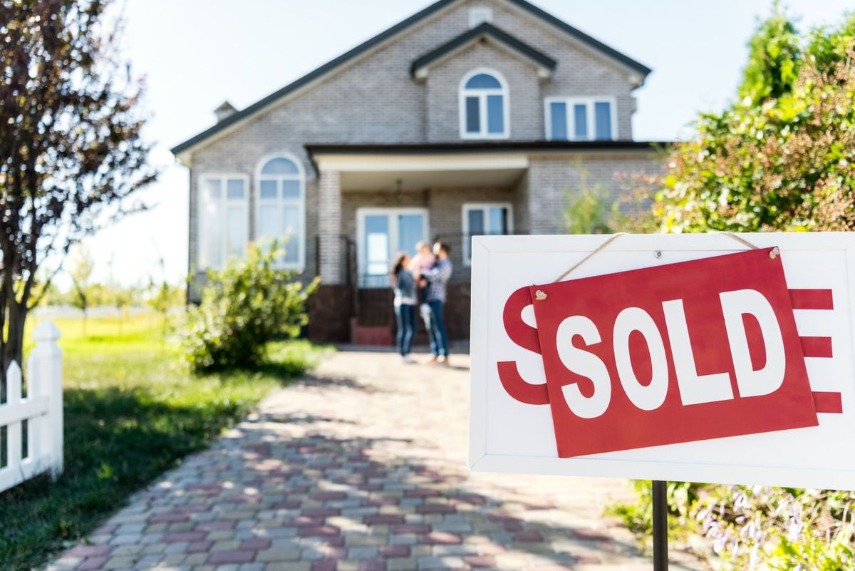 For sale sign outside of a recently sold house