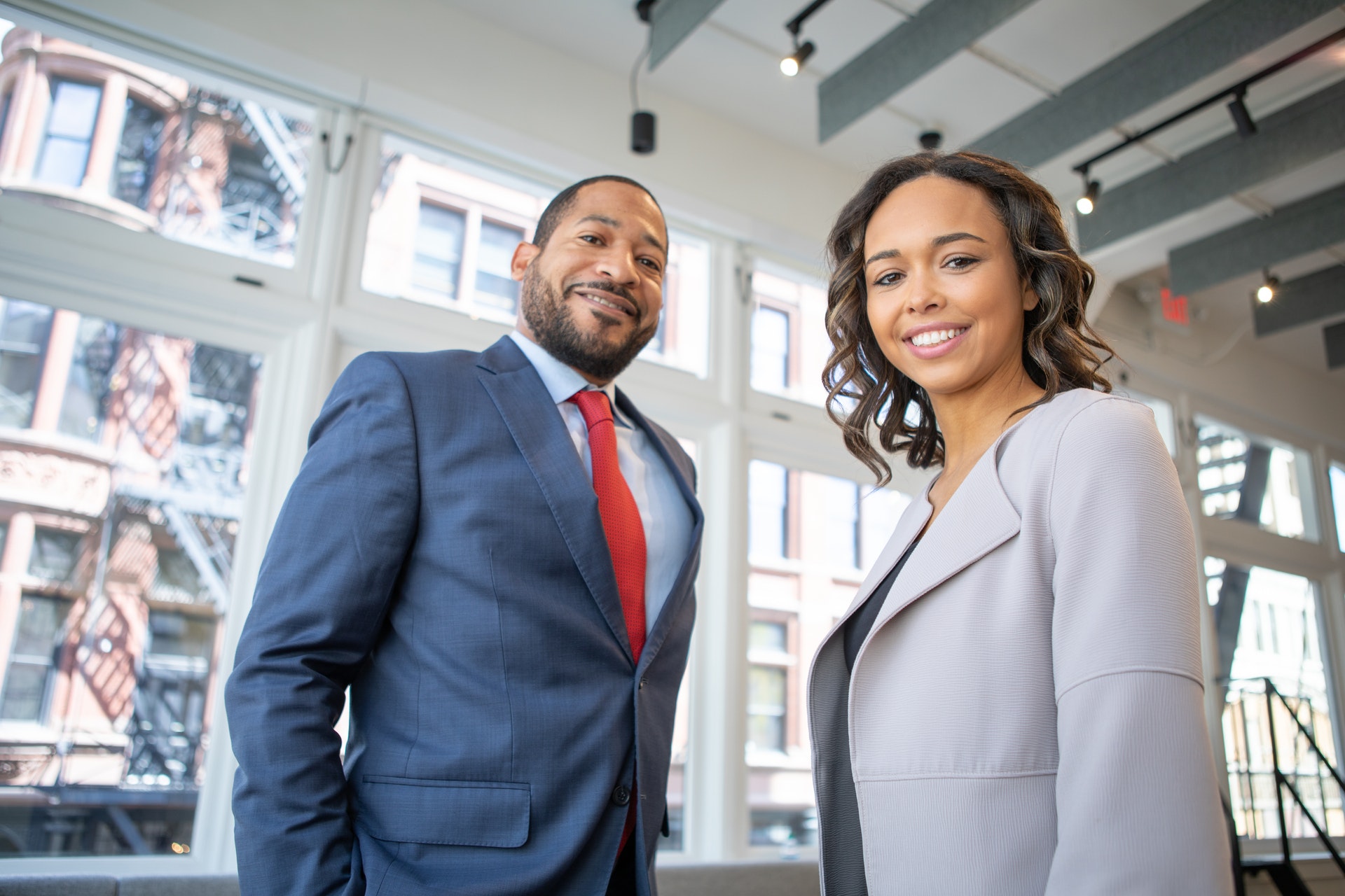 Man and woman realtors smiling