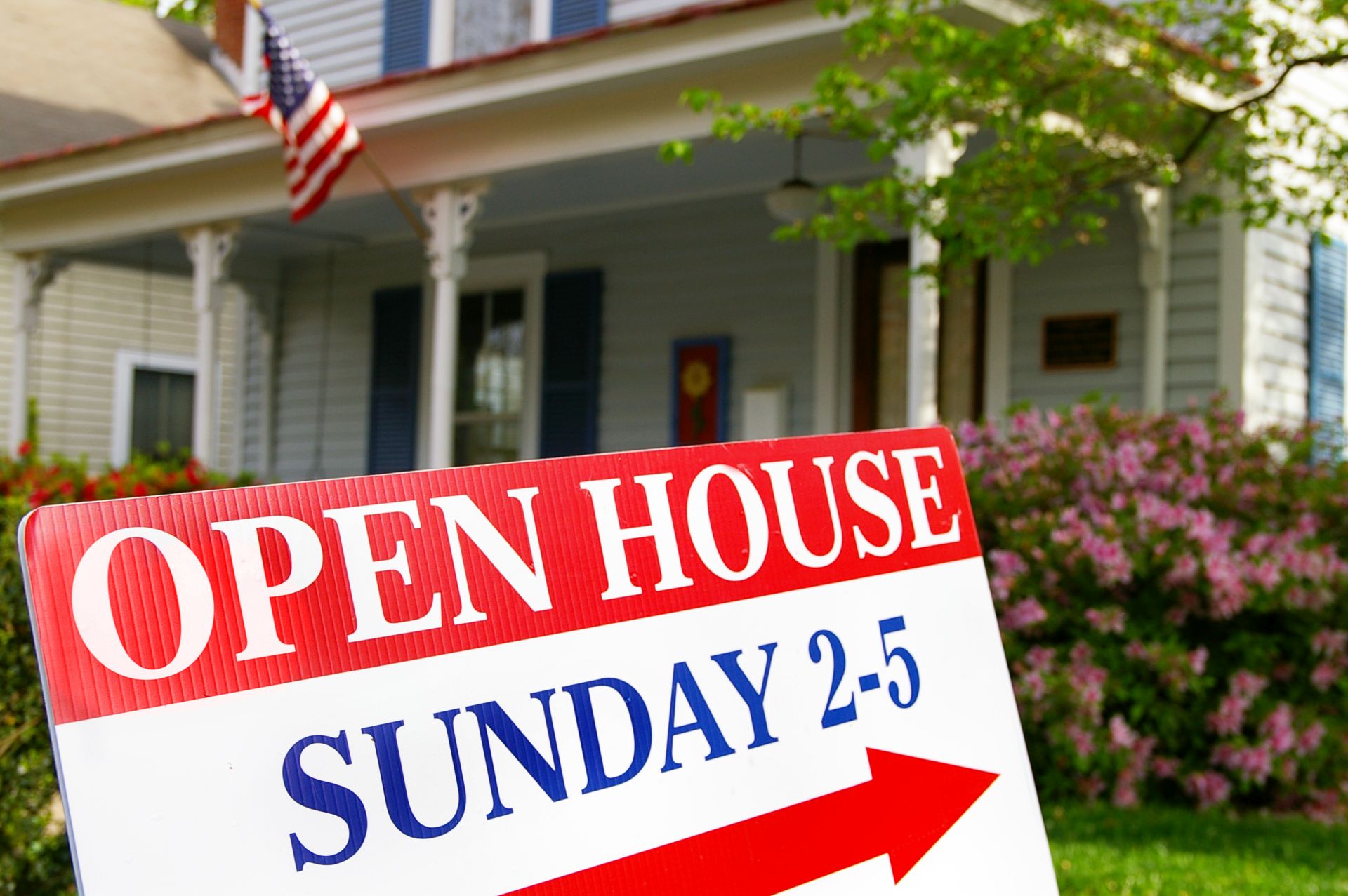 Open house sign in front of a home for sale