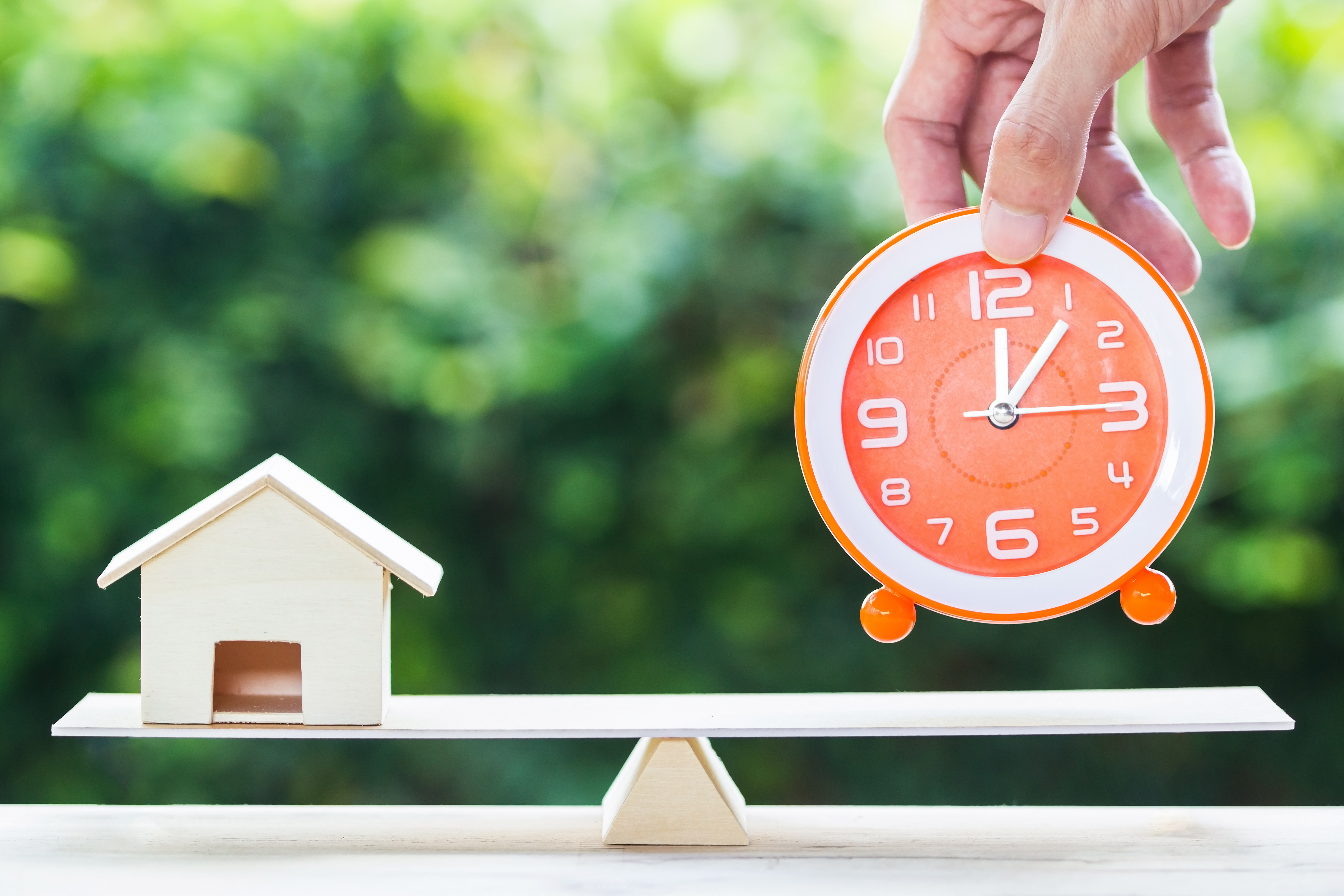 Potential home buyer putting down clock