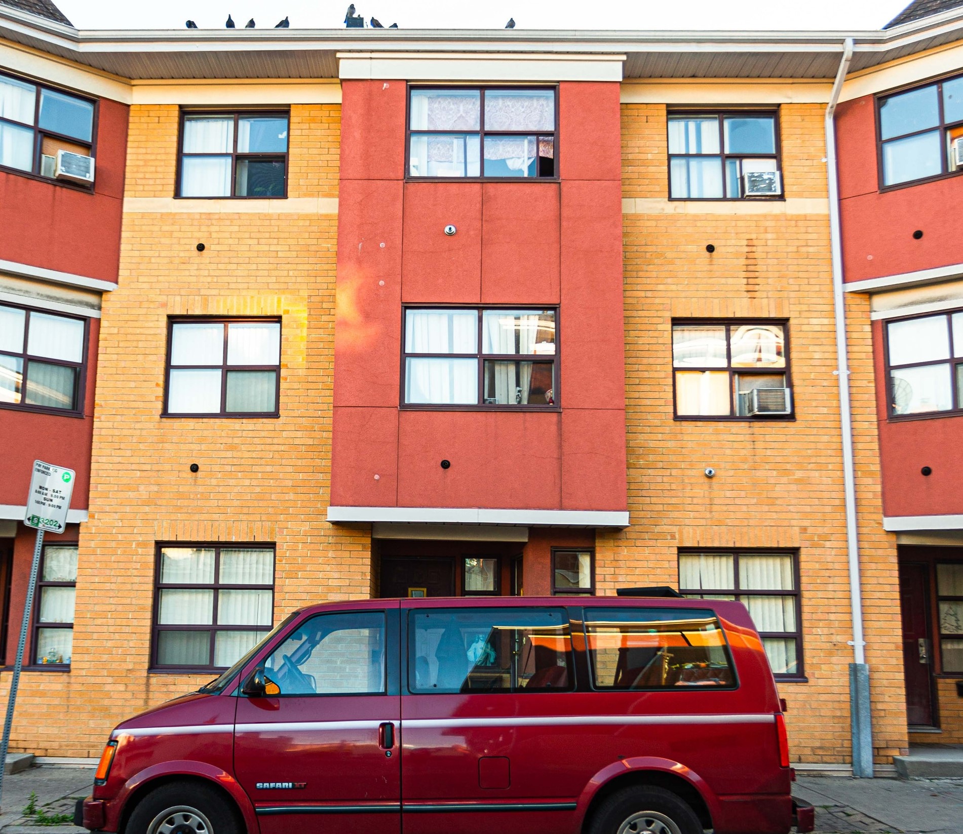 Red van parked outside of section 8 housing