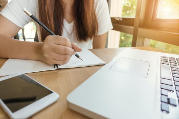 Student studying for her real estate license exam