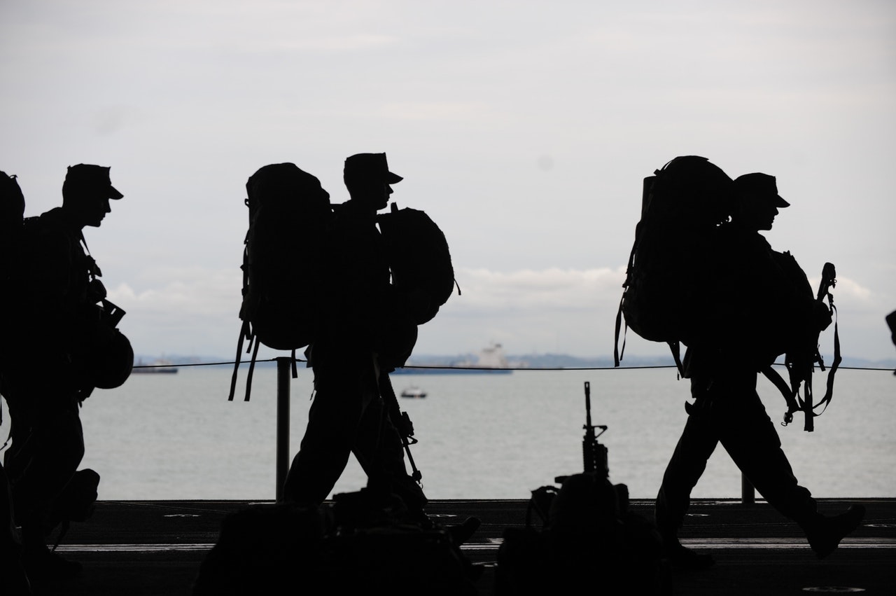 Usa military veterans walking off of plane